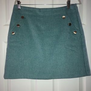 LOFT teal green mini skirt with gold buttons on each pocket. Fully lined.